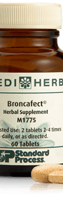 A bottle of Broncafect herbal supplement next to a tablet.
