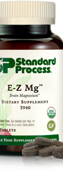 Image of E-Z Mg bottle next to tablets of magnesium supplements.