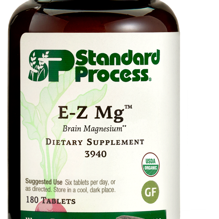 Image of E-Z Mg bottle next to tablets of magnesium supplements.