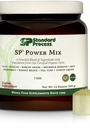 Tub of SP Power Mix next to a scoop of the green powder.