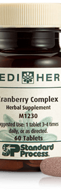 A bottle of Cranberry Complex next to a tablet.